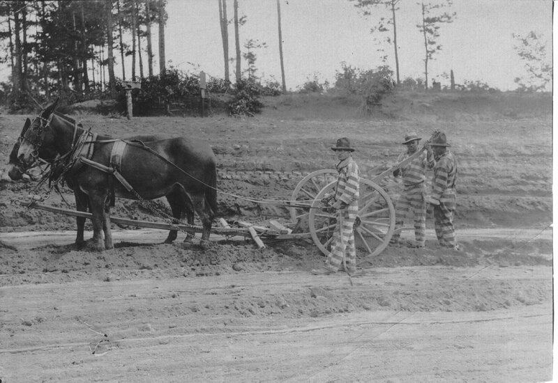 Burns, Robert Elliott, and two other prisoners plowing a field