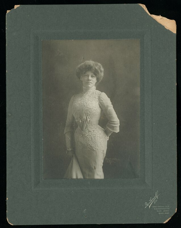 Portrait of Daisy Cheatham kneeling on chair without hat